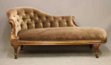 A VICTORIAN WALNUT FRAMED CHAISE LONGUE, button upholstered in mink draylon, the serpentine back