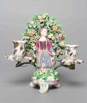 A BOW PORCELAIN FIGURAL CANDELABRUM, c.1760, modelled as a young Turkish girl wearing a puce