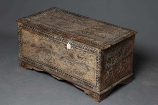 AN INDIAN CARVED WOOD CHEST of oblong form with panels of birds amongst foliate scrolls and with