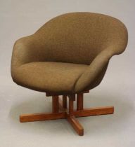 A RETRO TEAK FRAMED TUB LOUNGE CHAIR upholstered in brown tweed, raised on four rounded square