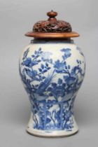 A CHINESE PORCELAIN VASE of inverted baluster form, painted in underglaze blue with birds amidst
