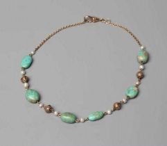 AN ARTS AND CRAFTS NECKLACE, the six irregular polished green stones with eleven freshwater pearl