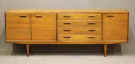 A RETRO TEAK LONG SIDEBOARD of Scandinavian design, the fascia with four drawers with inset oval