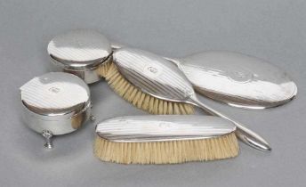 A SIX PIECE DRESSING TABLE SET, maker Birks, stamped Sterling, comprising a pair of circular boxes