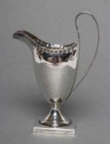 A LATE GEORGE III SILVER HELMET JUG, maker Peter and Ann Bateman, London 1792, of plain form with