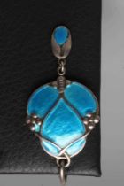 A MURRLE BENNETT PENDANT of trefoil form cast with three forget-me-nots and enamelled in blue,