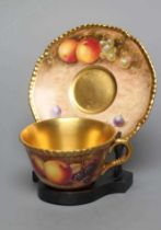 A ROYAL WORCESTER CHINA CABINET TEA CUP AND SAUCER, modern, the cup with solid gilt interior,