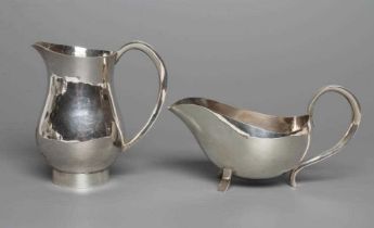 A SIILVER MILK JUG, maker Chesterfield College of Art, Sheffield 1975, of baluster form with