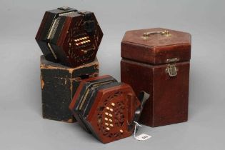 A LACHENAL & CO., LONDON CONCERTINA, Serial No. 14810, with mahogany ends and twenty-one bone