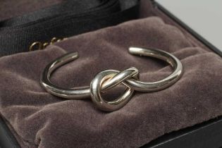 A GEORG JENSEN SILVER LOVE KNOT BANGLE, numbered A44BS, cased and boxed (Est. plus 24% premium