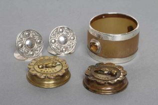 A PAIR OF STERLING SILVER IONA MENU HOLDERS, maker John Collie, Oban, c.1920, the circular discs