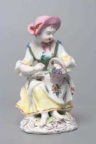 A BOW PORCELAIN FIGURE, c.1760, modelled as a young lady allegorical of Autumn from the seated
