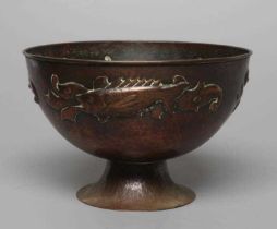 A NEWLYN COPPER PEDESTAL BOWL, early 20th century, hammered with a band of three scaly fish on a