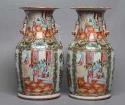 A PAIR OF CANTONESE PORCELAIN FAMILLE ROSE VASES of cylindrical form with waisted necks, the