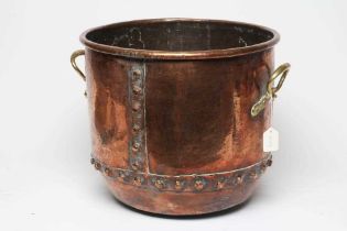 A COPPER LOG BIN, early 20th century, of cylindrical form with moulded rim, riveted seams and