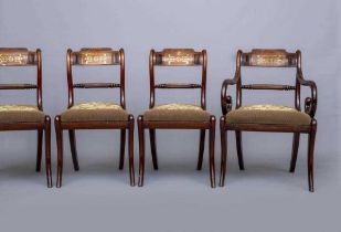 A SET OF EIGHT (6+2) REGENCY ROSEWOOD DINING CHAIRS, early 19th century, the scroll back uprights