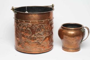 A DUTCH COPPER LOG BIN, early 20th century, of cylindrical form with brass loop handle, repousse