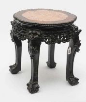 A CHINESE HARDWOOD JARDINIERE STAND, c.1900, of circular form with inset rouge marble top, the