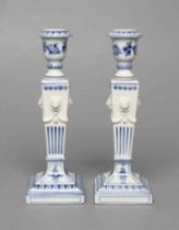 A PAIR OF ROYAL COPENHAGEN PORCELAIN CANDLESTICKS, 1948, the tulip sockets issuing from flared