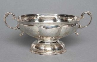 AN EDWARDIAN SILVER TWO HANDLED BOWL, maker Bertholdt Muller, Chester import mark, 1903, of oval