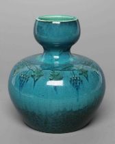 A RUSKIN VASE, early 20th century, of globular form with garlic type neck, the streaky blue