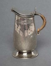 A MINIATURE SILVER JUG, maker Liberty & Co., Birmingham 1920, of tapering rounded cylindrical form