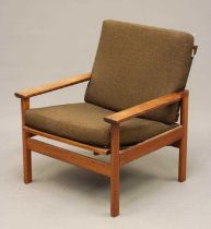 A RETRO TEAK FRAMED LOUNGE CHAIR with loose cushions in brown tweed, shaped arms, on rounded