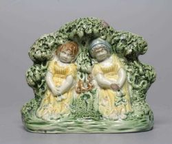 A STAFFORDSHIRE PRATTWARE SLIP CAST GROUP, early 19th century, modelled as the Babes in the Wood,