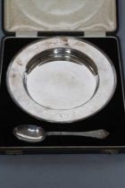 A TWO PIECE SILVER CHRISTENING SET, maker Elkington & Co., Birmingham 1928/29, comprising deep