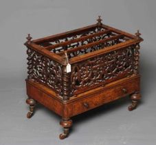 A VICTORIAN BURR WALNUT CANTERBURY of oblong form with fret work sides and two divisions on