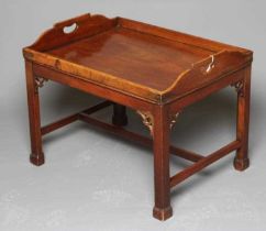 A MAHOGANY BUTLERS TRAY COFFEE TABLE, late 18th century and later, the oblong galleried top with