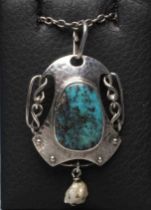 A MURRLE BENNETT PENDANT, the polished oval turquoise matrix panel in a planished mount with