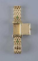 A LADY'S JAEGER-LECOULTRE EMERALD AND DIAMOND REVERSO WRISTWATCH/BRACELET, the oblong silvered