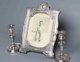 A SILVER EASEL BACK PHOTOGRAPH FRAME, maker's mark rubbed, Birmingham 1910, of shaped vertical