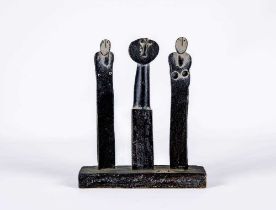 Y JOHN MALTBY (1936-2000) - a matt black stoneware sculpture of three standing figures on a plain