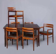 AN H. W. KLEIN FOR BRAMIN ROSEWOOD DINING TABLE AND CHAIRS, the extending oblong table with