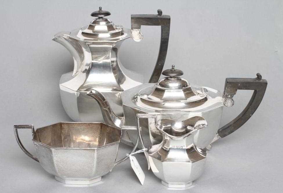 A FOUR PIECE SILVER TEA AND COFFEE SERVICE, maker Viners, Sheffield 1936, of octagonal form,