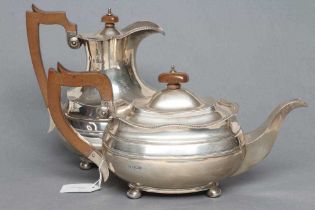 A SILVER TEAPOT AND MATCHING COFFEE POT, maker Sissons & Sissons, Sheffield 1926, of oblong baluster