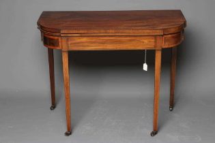 A GEORGIAN MAHOGANY FOLDING CARD TABLE, late 18th century, of breakfront oblong form with rounded