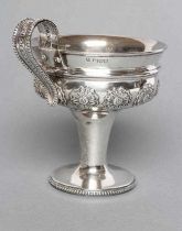 AN EDWARDIAN SILVER ARTS AND CRAFTS PEDESTAL CUP, maker Nathan & Hayes, Chester 1907, the double