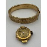 A 9 carat gold bangle together with a 14 carat gold cased ladies wrist watch. Total weight 37.4gm.