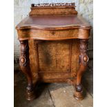 A Victorian burr walnut and marquetry Davenport with fitted stationary box over a red leather