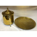 A large brass table top with Egyptian style decoration measuring 61cm in diameter along with a brass