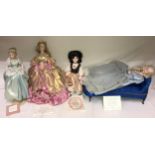 A collection of four Disney princess dolls to include three by Franklin heirloom two different '