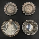 Two silver trinket trays (72gms), one shell shape on bun feet Birmingham 1891, one fretwork