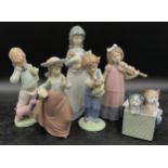 A collection of Lladro Nao figurines to include "Hush", "Boy on the Phone", "Girl with Puppy", "Girl