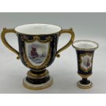 Two Royal Crown Derby vases depicting ships on a dark blue ground with gilt decoration by W.E.J.