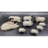 Collection of china animals, to include: Royal Doulton and Beswick pigs, one Beswick ram, two