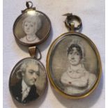 Three portrait miniatures on ivory. One lady, one gentleman and a child. Hair to reverse of one.