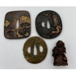Three Japanese Tsuba 8 x 7.5cm approximately, together with a wooden netsuke.